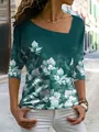 Elegant groen T-shirt met lange mouwen voor dames, bloemenprint en asymmetrische halslijn - S / Groen