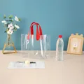 Clear PVC gift tote bag with vibrant red handles for wedding favors and party snacks - Red Transparent