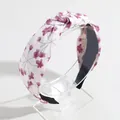 Wide top knot headband featuring a delicate purple floral pattern on white fabric - White Floral Print