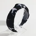 Stylish black knotted headband featuring white bird prints in soft knitted fabric - Black Bird Print