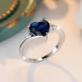 Elegant heart-shaped deep blue zircon ring with polished silver-plated band and crystals. - US 7 / Silver Royal Blue Zirconia