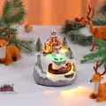 Musical Christmas resin ornament featuring rotating train and glowing LED church - Double Rotating Snowman Style