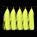Fluorescent yellow paper tassel garland for party decorations on black background - Yellow Neon Paper Tassel
