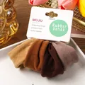 Set of 4 coffee-colored thick elastic hair ties scrunchies on a white display card - 4 Pieces/Pack / Coffee