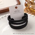 Set of four high elasticity black flat hair ties presented on a white display card - #07 Flat Cord Black (4-Piece Set on Card)