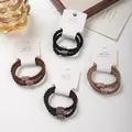 Zweiteiliges Set aus hochwertigen geflochtenen Haargummis mit Strasssteinen in neutralen Farben. - Vollzirkonia-Stil / 2er Pack / Mehrfarbig