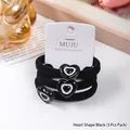 Set of 3 black elastic hair ties with cute heart charms on white display card - Black
