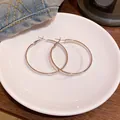 High-quality minimalist large silver hoop earrings with a polished mirror finish - Exaggerated Large Hoop Earrings / Silver