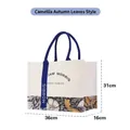 Large William Morris floral canvas tote bag featuring blue ribbon and 36x16x31cm dimensions - Camellia Autumn Leaves Pattern / L