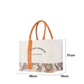 Large William Morris floral print canvas tote bag with orange ribbon and size details - Golden Lily Print / L