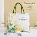 Large canvas tote bag featuring yellow chamomile floral patterns and green handles - Daisy Print Pattern / L