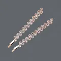 Sparkling gold-toned hair clips featuring a clear rhinestone zigzag design for women - Zigzag Wave Style (HS-J5922RG) / Rose Gold