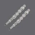 Set of two elegant silver-tone hair clips with sparkling clear rhinestones on grey background. - Linear Clear Faux Diamond Style (HS-J3052S) / Silver