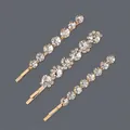 Set of three elegant gold-toned hairpins featuring sparkling clear rhinestone accents. - Plum Blossom Round Stone 3-Piece Set (HS-J6448G) / Gold