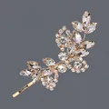 Elegant leaf-shaped golden bobby pin intricately adorned with sparkling clear crystal rhinestones - Luxury Asymmetric Leaf and Flower Style (HS-J3517G) / Gold