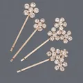 Set of four elegant gold-plated hairpins with sparkling rhinestone flower motifs. - 4-Piece Five-Petal Flower Style (HS-J7485G) / Gold