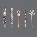 Elegant set of five gold-tone bobby pins featuring colorful rhinestones and crystals. - 5-Piece Multi-Shape Color Stone Set (HS-J6781) / Gold