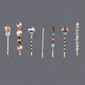 Set of 7 gold-toned bobby pins with colorful rhinestones and crystals on grey background. - 7-Piece Multi-Color Set (HS-J6782) / Gold