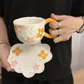Ceramic floral coffee cup set with heart handle and petal saucer in cream and orange - Orange Flower Cloud Cup 300ml + Saucer 17cm