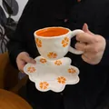 Handmade cream ceramic coffee cup and petal saucer set with orange floral pattern - Orange Petal Cloud Cup 300ml + Saucer 17cm