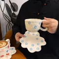 Irregular white ceramic coffee cup with blue floral pattern and handmade texture - Light Blue Floral Cloud Cup 300ml + Saucer 17cm