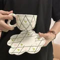 White ceramic coffee cup set with green lattice, pink bows, and heart handle - Relief Green Grid Cup And Saucer / Cup And Saucer