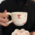 White irregular ceramic coffee cup set with pink flowers and a red bow pattern - Korean-style Bow Cloud Single Cup 300ml