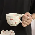 Irregular cream ceramic coffee cup and saucer set with red cherry and bow patterns - Cherry Bow Cloud Single Cup 300ml