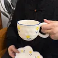 Handcrafted cream ceramic coffee mug and cloud saucer with blue flower patterns - Yellow Flower Cloud Design 300ml Per Cup