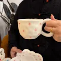 White ceramic coffee cup and saucer set with pink floral patterns and uneven texture - Starry Flower Cloud Single Cup 300ml