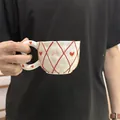 Handmade ceramic coffee mug with red heart and bow patterns in cream white finish - Embossed Red Mesh Cloud Single Cup 300ml