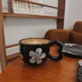Black vintage flower ceramic coffee cup with a unique heart-shaped handle - Black Background With White Petals And Cloud Design 300ml Single Cup