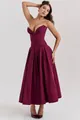 Detail of the deep wine red corset dress featuring a V-neckline and full pleated skirt - Burgundy