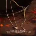 Vintage-Halskette in Gold mit Zirkonia-Zylindermotiv und kleinem Sternanhänger - Schlanke Taille Stil