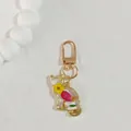 Detailed view of cat-shaped resin keychain with yellow and pink real dried flowers - Yellow Flower Cat