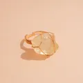 Elegant wire-wrapped ring featuring a natural raw yellow crystal on a neutral background. - Yellow Crystal / Gold