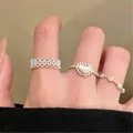Elegant silver heart and bow ring set with minimalist openwork detail for women - Hollow Geometric Heart Ring Set (9889) / Three-Piece Set / Silver