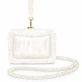 Detailed view of the pearlescent white acrylic evening clutch bag with elegant pearl strap - Dumpling