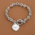 Elegante bracciale in acciaio inossidabile con ciondolo a cuore e chiusura a levetta - Colore acciaio