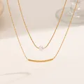 Elegant double-layered gold titanium steel necklace with white pearl and curved bar - Smile Pearl (XKN0289)