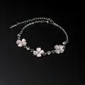 Zoete roze kattenoogsteen bloem armband met fonkelende strass zilveren ketting - Armband / Roze