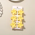 Set of 6 yellow frangipani flower hair clips for women presented on a display card. - 4cm Pearly Frangipani Style / Set of 6 / Pearlescent Lemon Yellow
