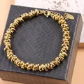 Hip-hop style gold-colored stainless steel ring-link bracelet on jewelry display box - Adjustable Size / Gold