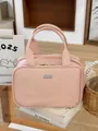 Bolsa de maquillaje rosa con tres compartimentos y un asa superior portátil - Rosa