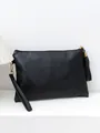 Stylish black pebbled leather envelope clutch bag with wrist strap and tassel detail - Black Texture