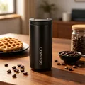 Elegant matte black stainless steel coffee travel mug featuring a vertical logo design - 400ml / Black