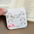 Weekly set of 7 pairs of delicate floral and heart stud earrings on display card - SLO2 Butterfly Pearl Flower [7-Piece Set]