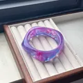 Vibrant purple and blue marbled resin bangle with a curved chunky acetate design - Metallic Purple