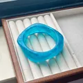 Elegant turquoise blue marble effect resin bangle with unique curved square shape - Dreamy Cyan