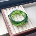 Elegant green marbled resin bangle bracelet with a unique curved square shape design - Green with Swirl
